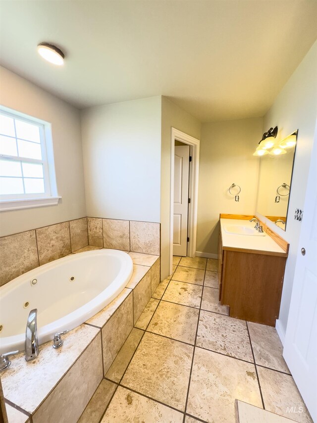 166 Eric Rd, Shoshone, ID 83352 - bathroom featuring vanity, a jetted tub, and baseboards