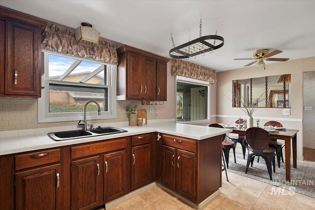 6426 W Fairfield Ave, Boise, ID 83709 - kitchen with a sink, light countertops, plenty of natural light, and ceiling fan