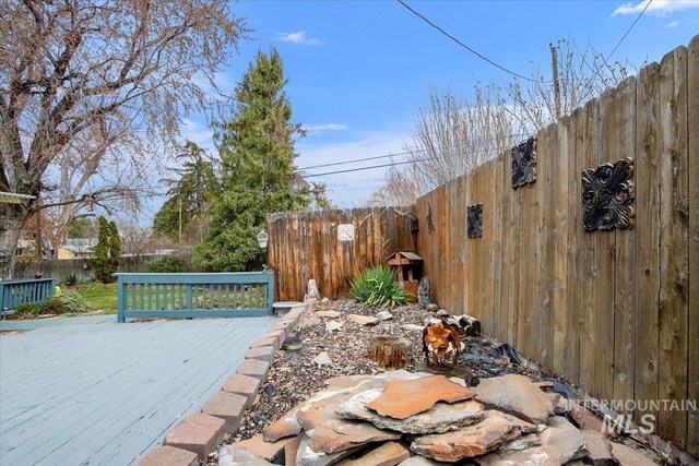 6426 W Fairfield Ave, Boise, ID 83709 - wooden deck with a fenced backyard