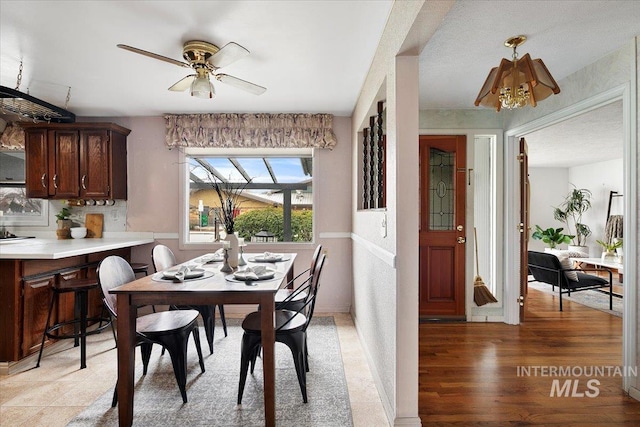6426 W Fairfield Ave, Boise, ID 83709 - dining room with a ceiling fan and light wood finished floors