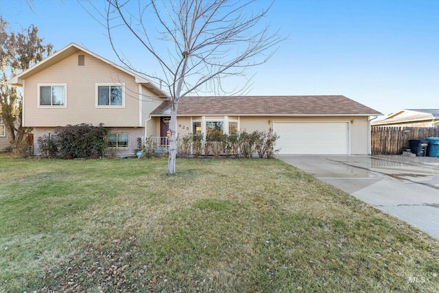 split level home with a front yard and a garage