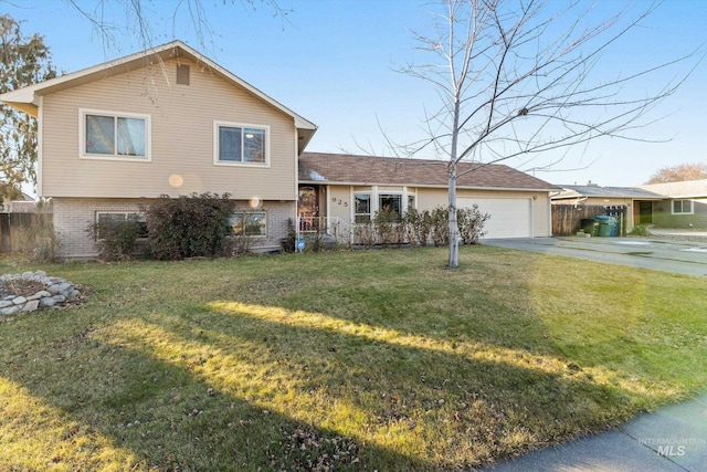 split level home with a garage and a front yard