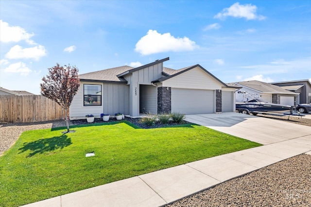 view of front facade featuring a front lawn and a garage