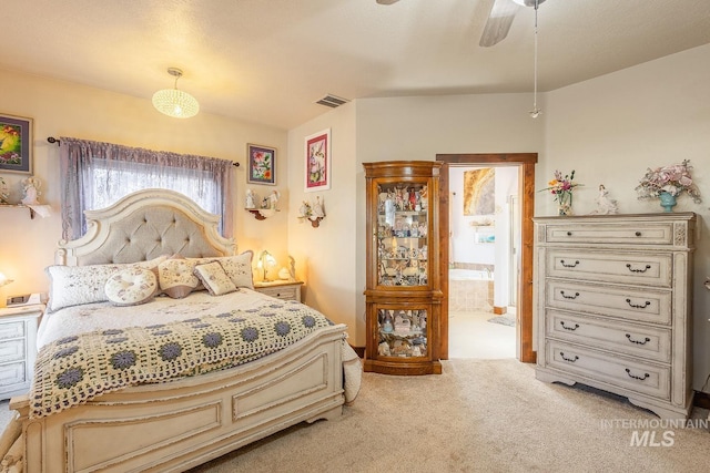 carpeted bedroom with connected bathroom