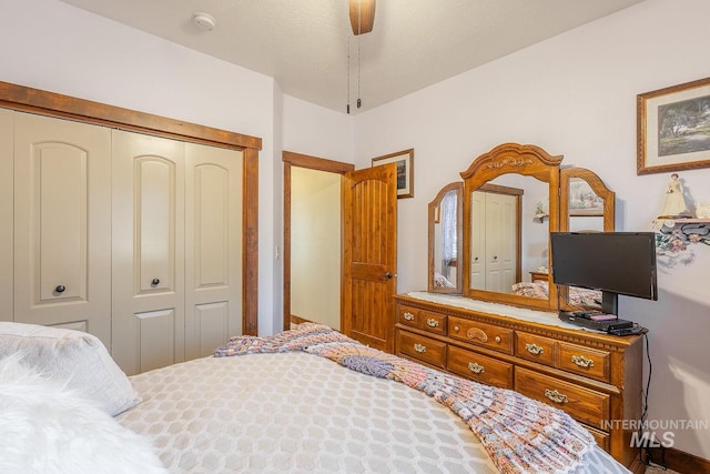 bedroom with ceiling fan and a closet