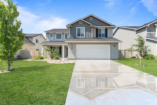 12817 Ironstone Dr, Nampa, ID 83651 - view of front facade with board and batten siding, an attached garage, and concrete driveway