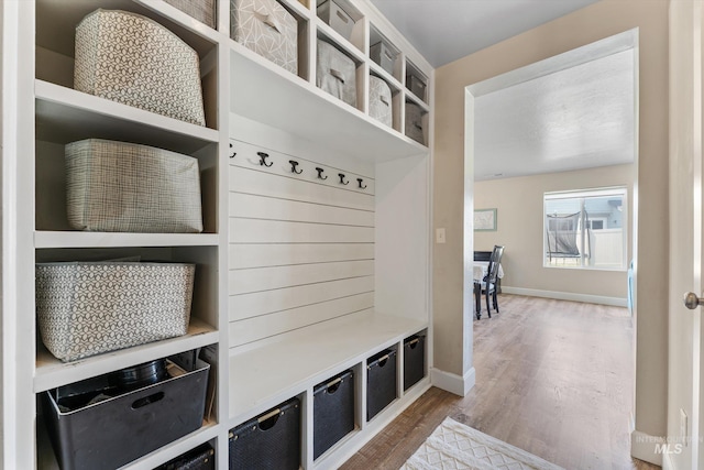 12817 Ironstone Dr, Nampa, ID 83651 - mudroom featuring wood finished floors and baseboards