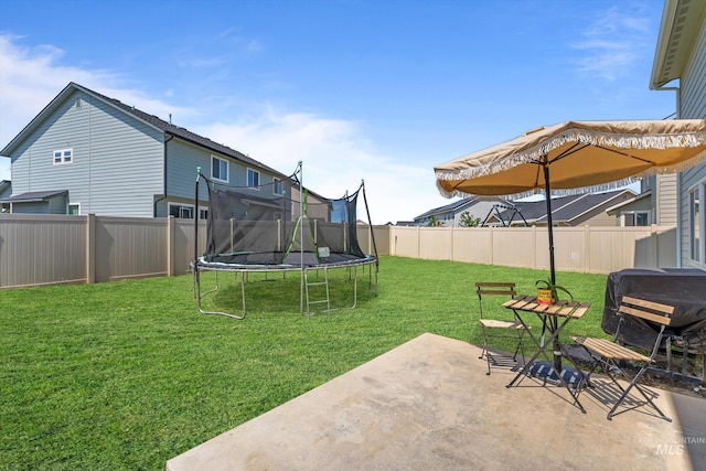 12817 Ironstone Dr, Nampa, ID 83651 - view of yard featuring a trampoline and a patio area