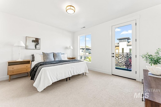 bedroom with access to exterior, baseboards, and light carpet