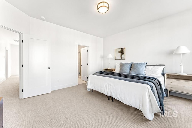 carpeted bedroom with baseboards