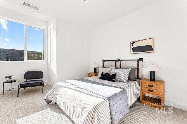 carpeted bedroom with baseboards