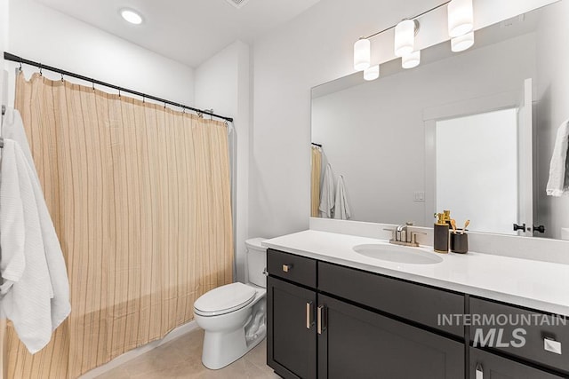 full bathroom featuring toilet, tile patterned flooring, vanity, and a shower with curtain