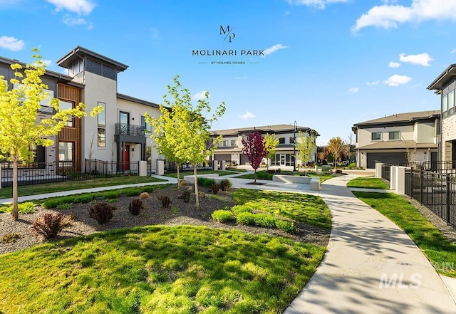 view of property's community with a residential view and fence