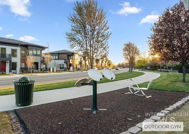 view of community with a yard and a residential view