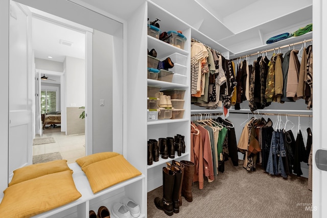 walk in closet featuring visible vents and carpet floors