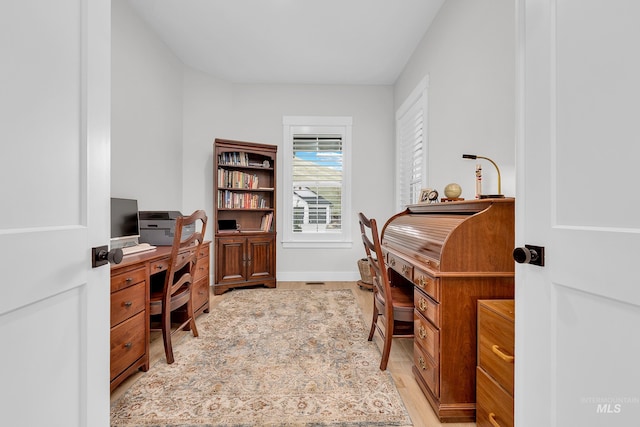 office with light wood finished floors and baseboards