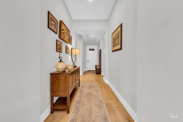 hallway with attic access, light wood finished floors, recessed lighting, and baseboards