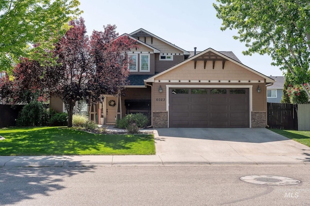 6023 S Augustine Ave, Boise, ID 83709 - craftsman inspired home featuring concrete driveway, stone siding, and an attached garage