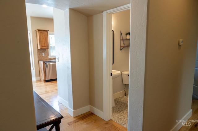 6023 S Augustine Ave, Boise, ID 83709 - hall with light wood finished floors and baseboards