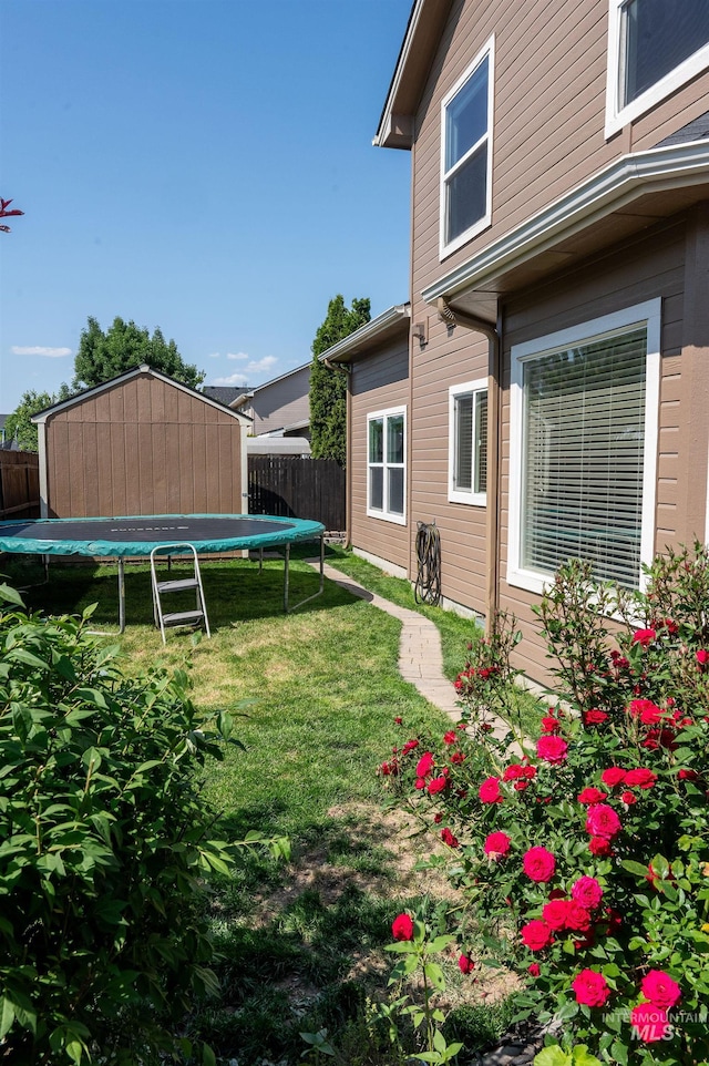 6023 S Augustine Ave, Boise, ID 83709 - view of yard featuring a trampoline and an outdoor structure