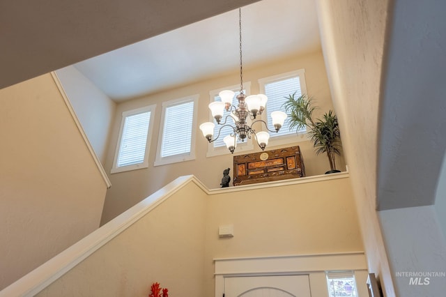 6023 S Augustine Ave, Boise, ID 83709 - stairs with a chandelier