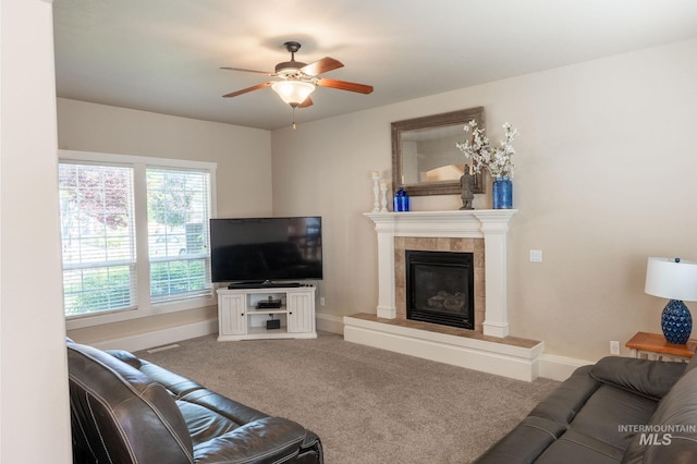 6023 S Augustine Ave, Boise, ID 83709 - carpeted living room featuring a ceiling fan, a tile fireplace, and baseboards