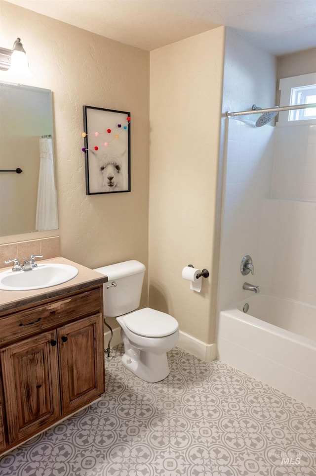 6023 S Augustine Ave, Boise, ID 83709 - bathroom with toilet, vanity, shower / bath combo with shower curtain, and tile patterned flooring