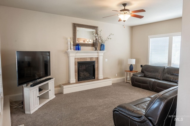 6023 S Augustine Ave, Boise, ID 83709 - carpeted living room featuring ceiling fan, a tiled fireplace, and baseboards