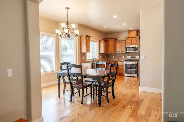 6023 S Augustine Ave, Boise, ID 83709 - dining area with a chandelier, light wood-type flooring, baseboards, and recessed lighting