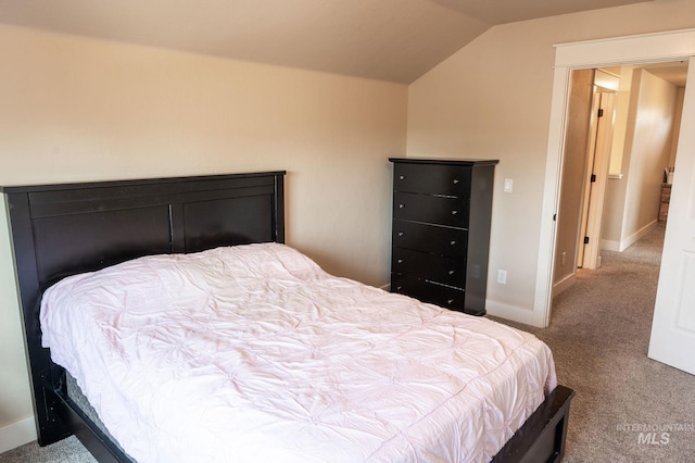 6023 S Augustine Ave, Boise, ID 83709 - bedroom featuring carpet floors, vaulted ceiling, and baseboards