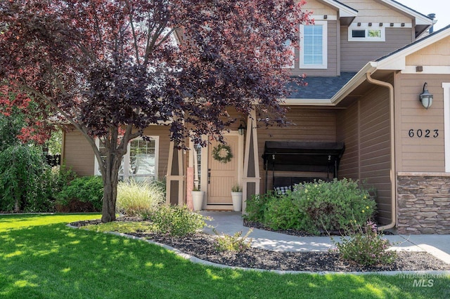 6023 S Augustine Ave, Boise, ID 83709 - doorway to property with a lawn and a shingled roof
