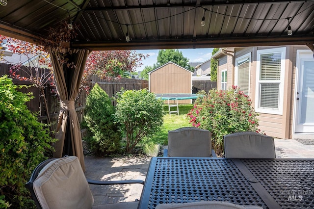 6023 S Augustine Ave, Boise, ID 83709 - fenced backyard featuring a patio area and outdoor dining space