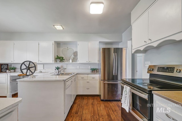 833 Nebraska, Gooding, ID 83330 - kitchen featuring stainless steel appliances, open shelves, dark wood-type flooring, white cabinetry, and light countertops