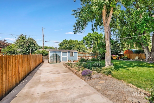 833 Nebraska, Gooding, ID 83330 - view of front of property featuring a fenced backyard, a storage shed, and concrete driveway