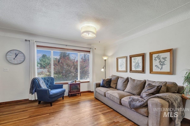 833 Nebraska, Gooding, ID 83330 - living area with wood finished floors and a textured ceiling