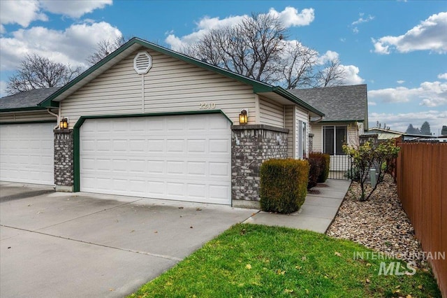 view of side of home with a garage