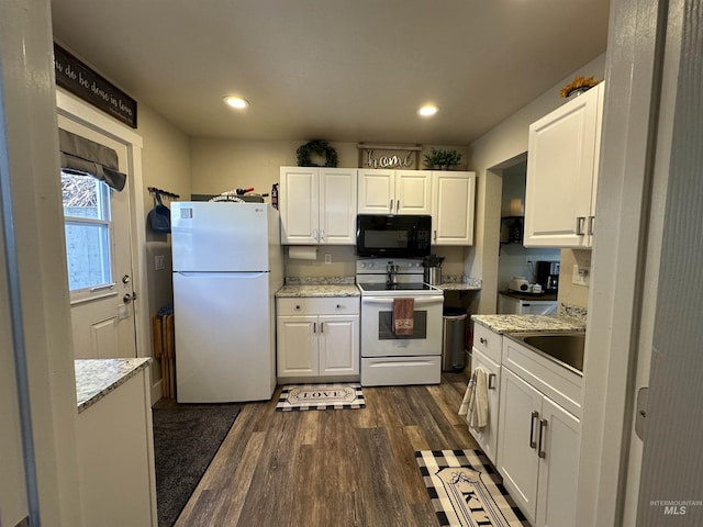 kitchen with a sink, white cabinets, dark wood-style floors, recessed lighting, and white appliances