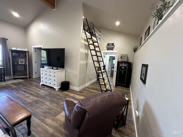 living room with baseboards, lofted ceiling with beams, recessed lighting, and wood finished floors