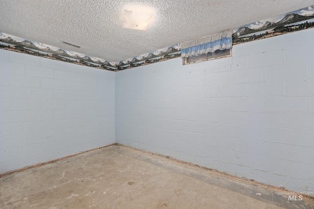 basement with a textured ceiling