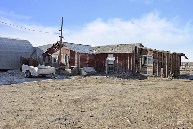 exterior space with an outbuilding