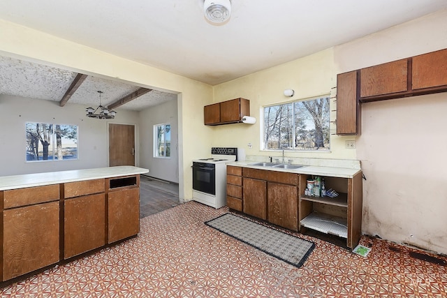 kitchen featuring beam ceiling, electric stove, sink, and a chandelier