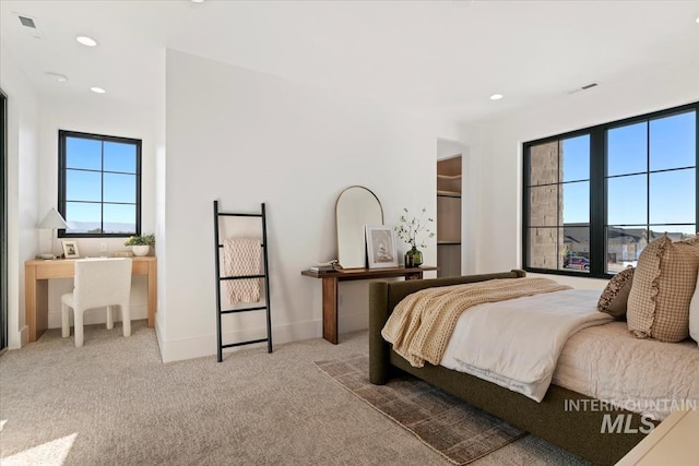 carpeted bedroom with baseboards, visible vents, and recessed lighting