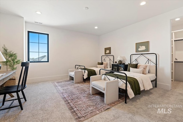 bedroom with baseboards, light carpet, and recessed lighting