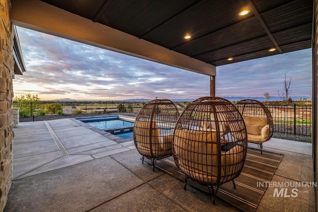 view of pool with fence, a fenced in pool, and a patio
