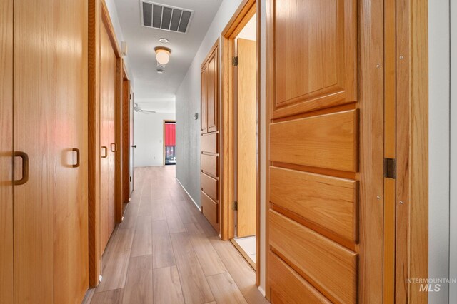 hall featuring light wood-type flooring