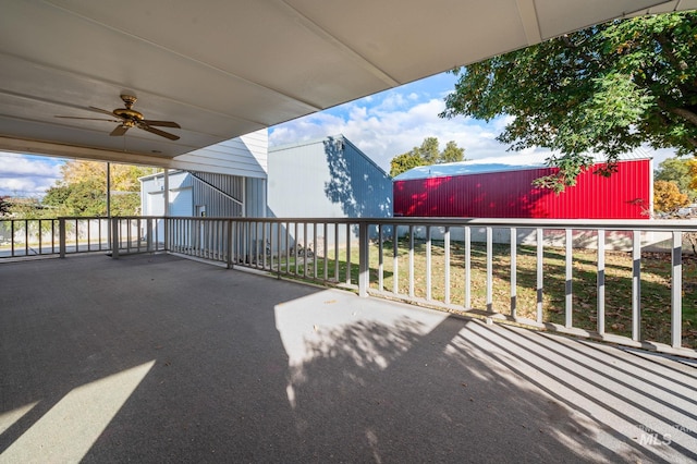 view of patio / terrace featuring ceiling fan and an outdoor structure