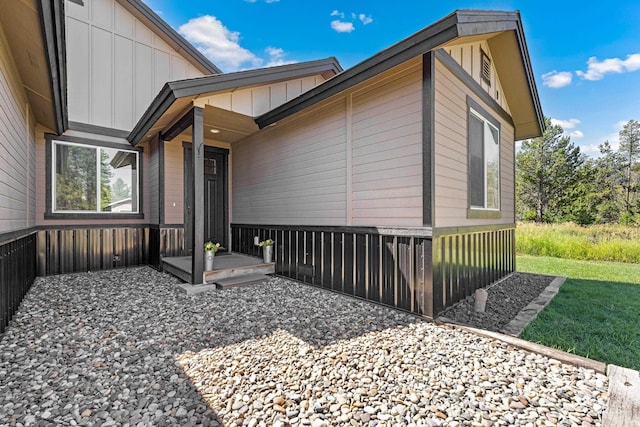 doorway to property with board and batten siding