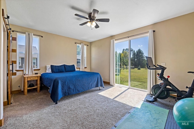 carpeted bedroom featuring ceiling fan, access to outside, and baseboards