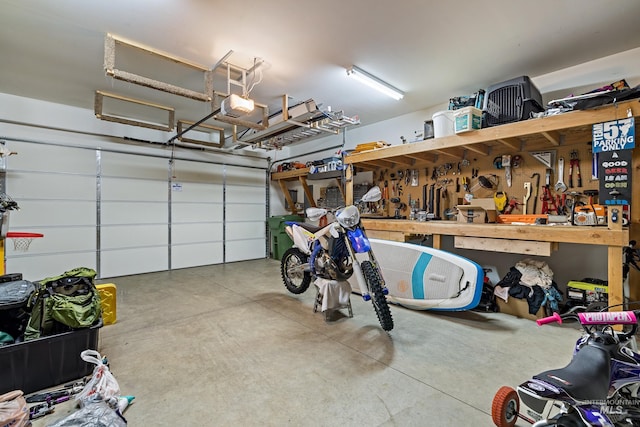 garage featuring a workshop area and a garage door opener