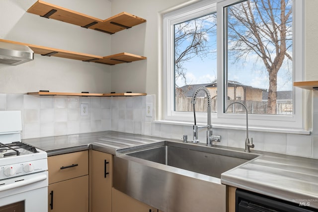 kitchen featuring a sink, black dishwasher, white gas range oven, stainless steel counters, and decorative backsplash